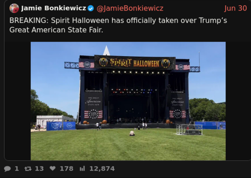 [Screenshot of xcancel post] Jamie Bonkiewicz @JamieBonkiewicz     Jun 30 BREAKING: Spirit Halloween has officially taken over Trump's Great American State Fair. [Image of a stage in front of an almost empty field, with a Spirit Halloween banner dropped in front of the existing marquee]