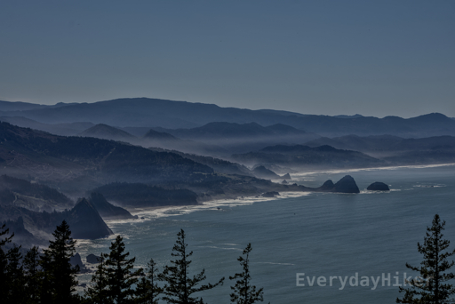 The view to the south from Humbug Mountain, light fog fills in the valleys of the rippling hills along the coast.
